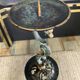 Empire style bronze candlestick with a candle holder