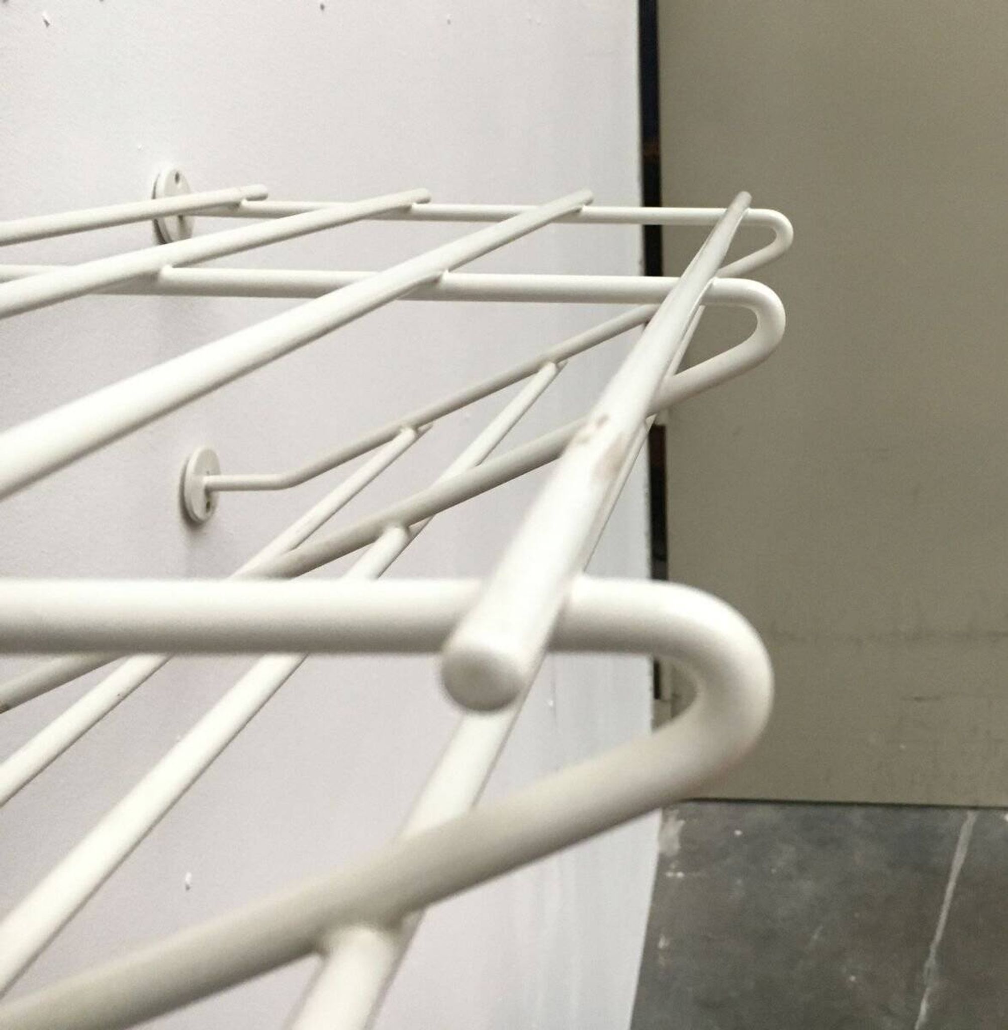 Mid-century modern minimalist metal coat rack from the 1960s.