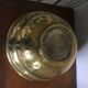 Art Deco brass pot cover