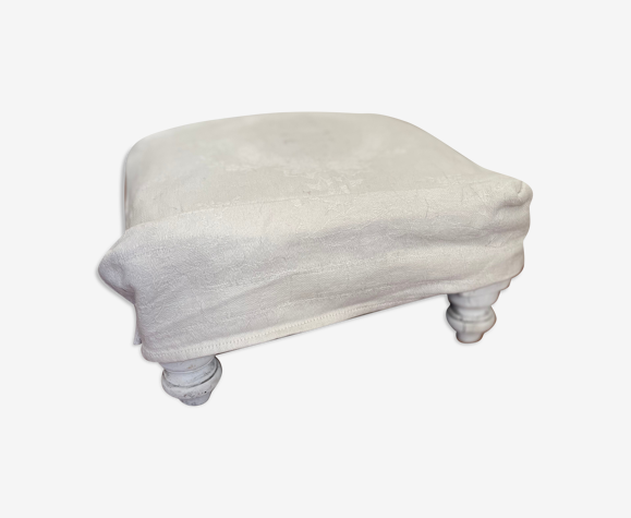Wooden footrest and antique linen