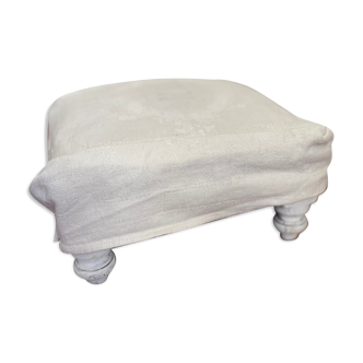 Wooden footrest and antique linen