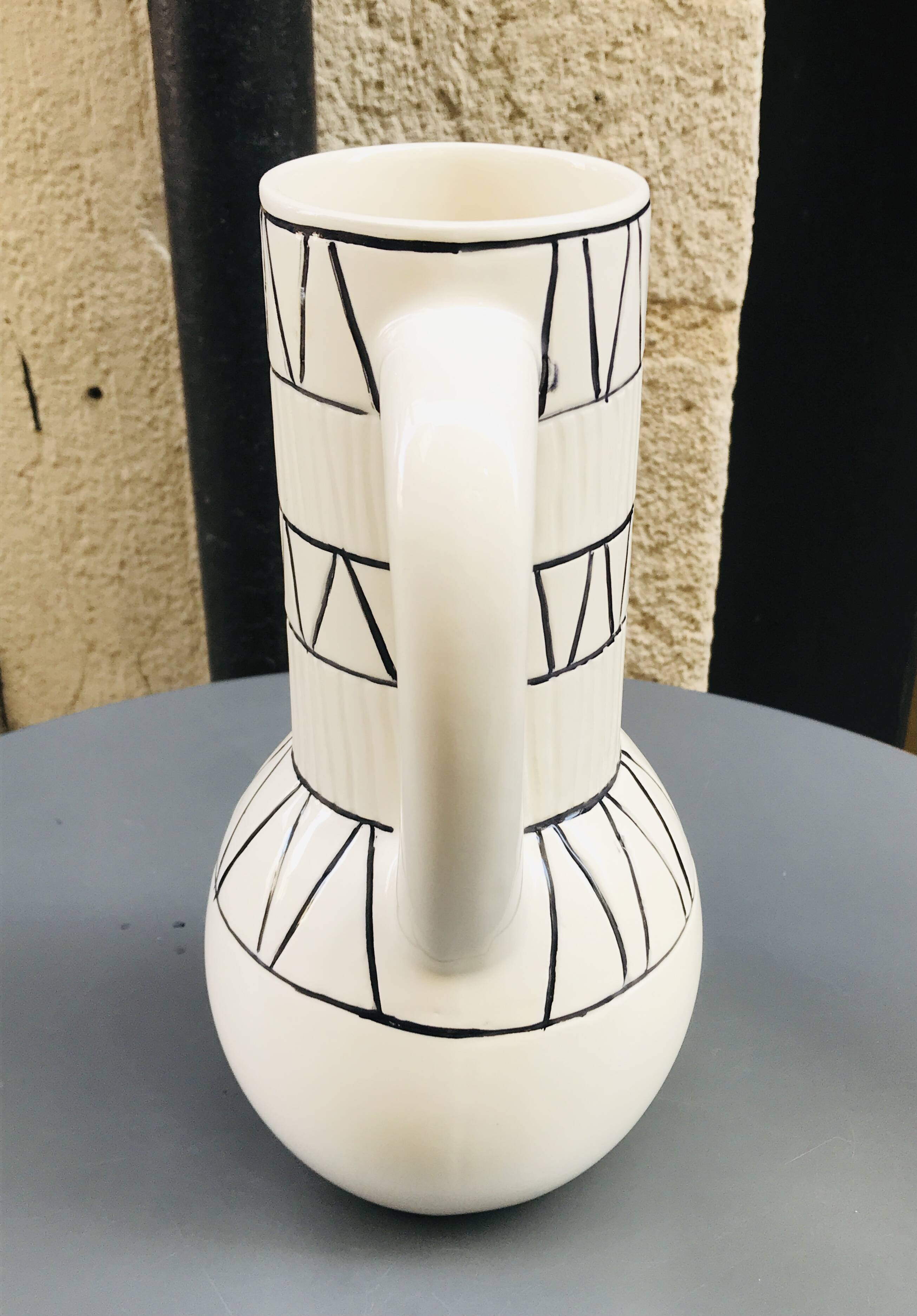 Vase with geometric pattern handles