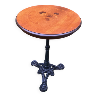 Pedestal table with inlaid top and flower decoration