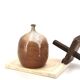 Ovoid vase with a small neck in brown beige ceramic and white drips.