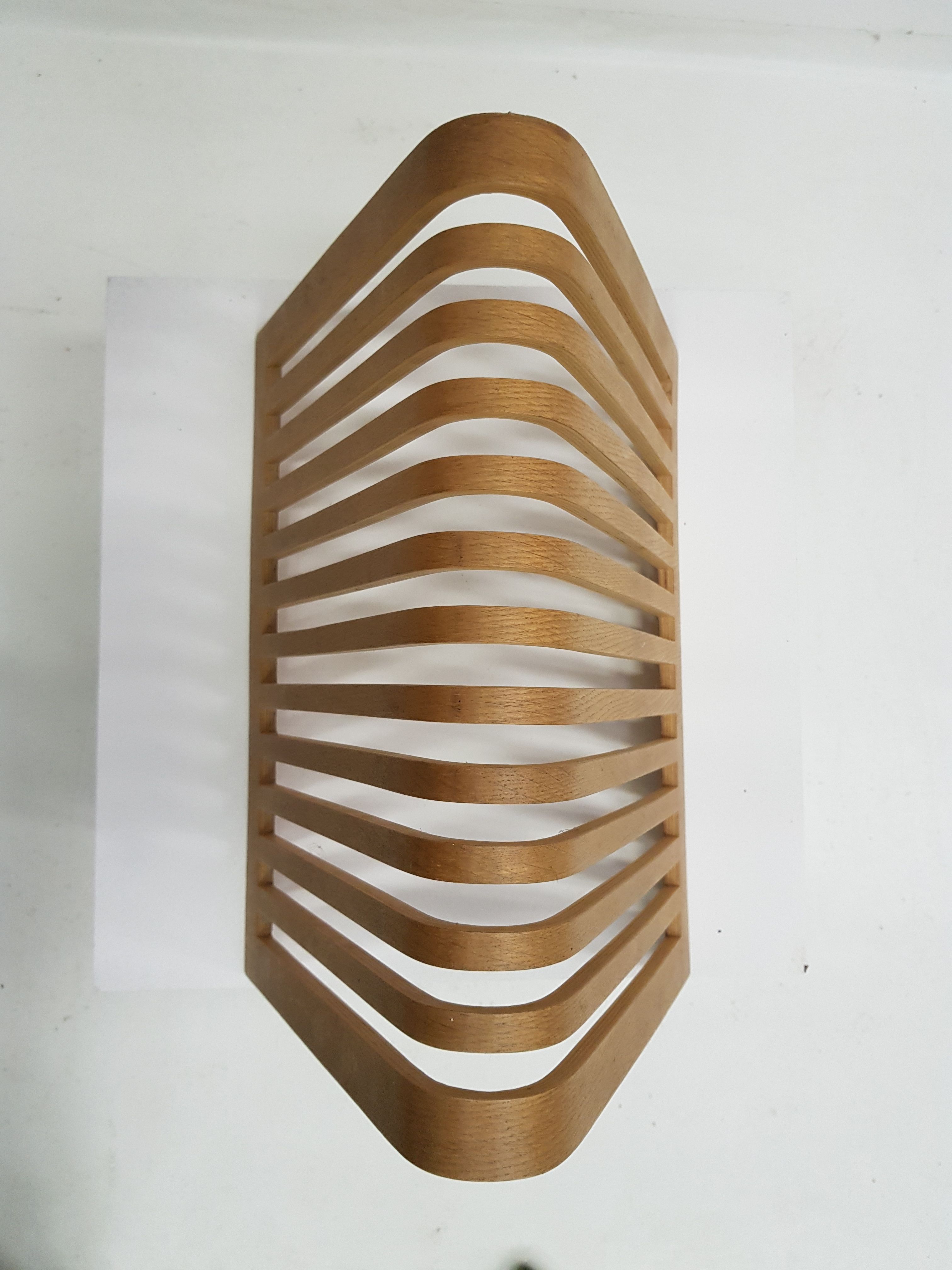 Vintage magazine rack in thermoformed wood from the 60s