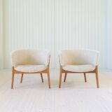 Mid-century lounge chairs in sheepskin/shearling and stained wood, Sweden, 1962.