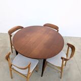 Round extendable wooden dining table