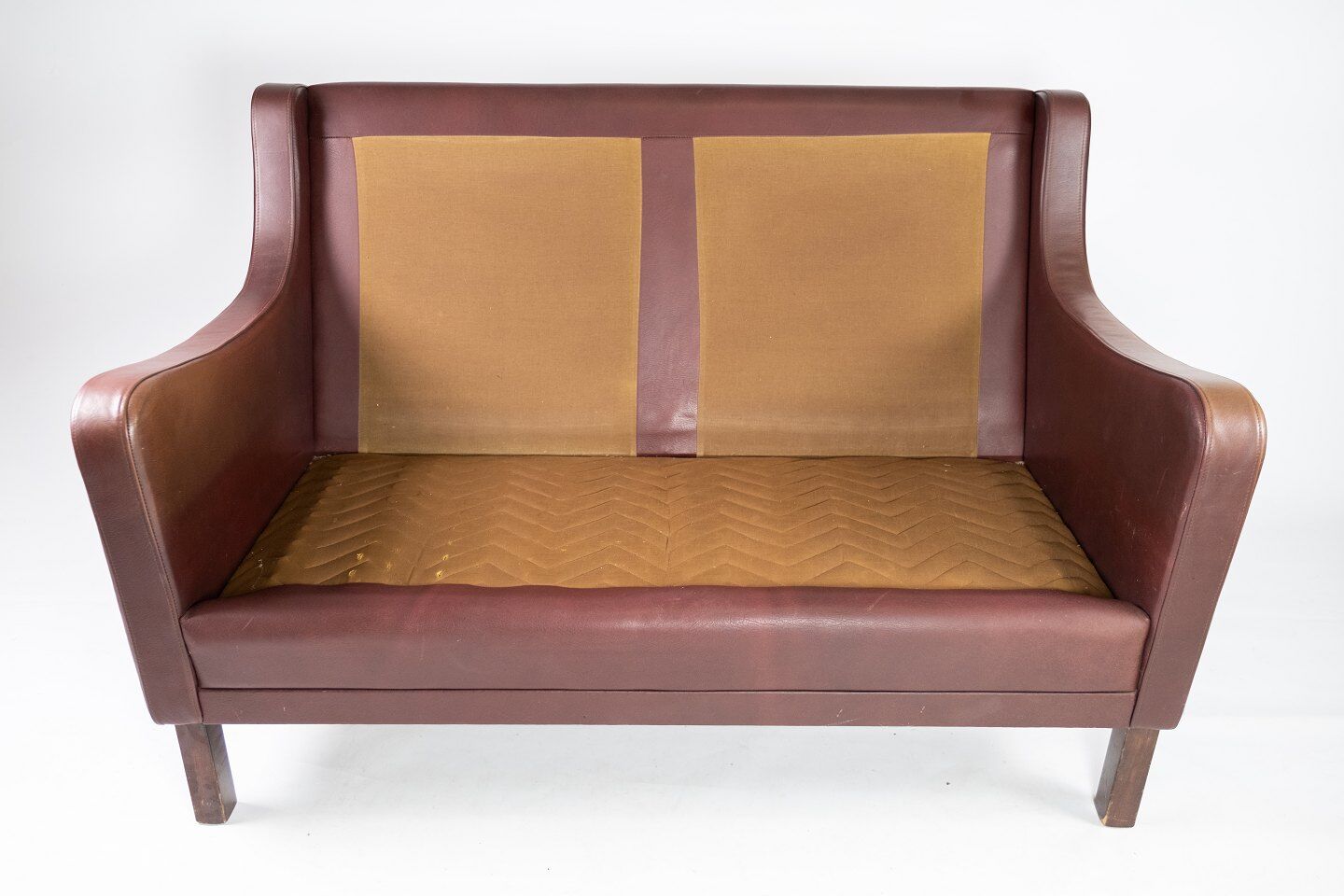 Two seater sofa, with red brown leather by Stouby Furniture