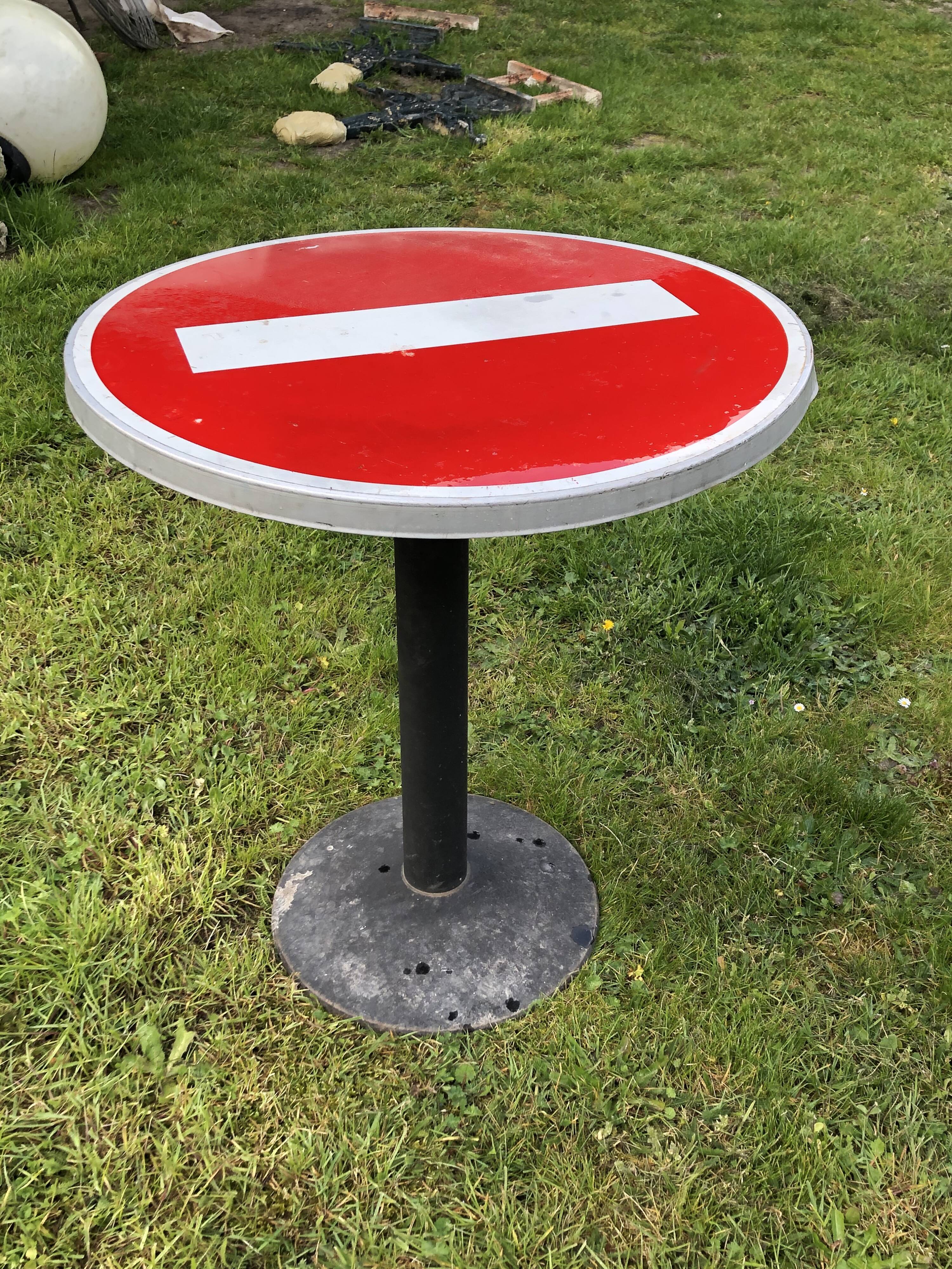 Table of bistro/garden vintage road sign meaning forbidden