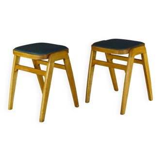 Two MID-Century green vinyl stools from the 1970s with tapered legs.