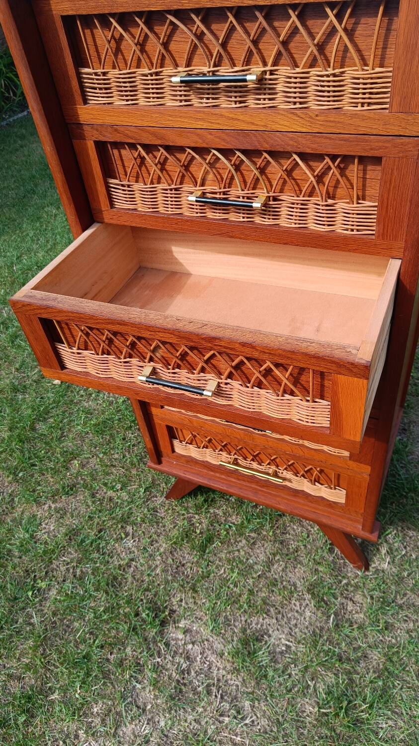 Tall chest of drawers in wood and rattan with splayed legs