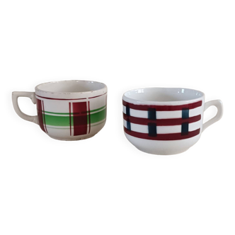 2 mismatched iron earth cups