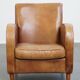 Fauteuil design en cuir de vachette couleur cognac clair