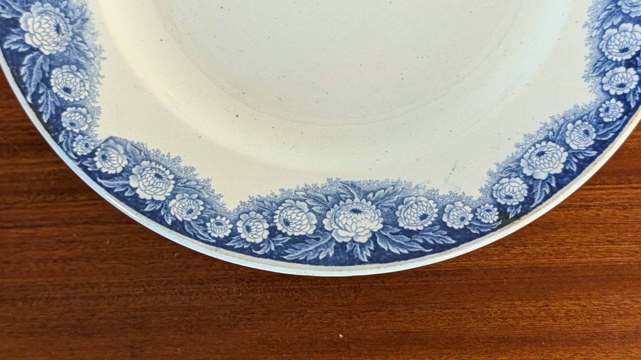 Antique compote dish with blue floral decoration.