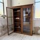 Glass-fronted walnut library 1900
