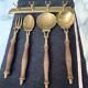 Old kitchen utensils in brass and wood.