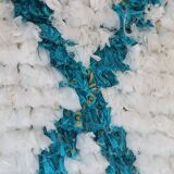 White Boucherouite Moroccan Berber rug with colorful patterns