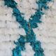 White Moroccan Boucherouite Berber rug with colorful patterns