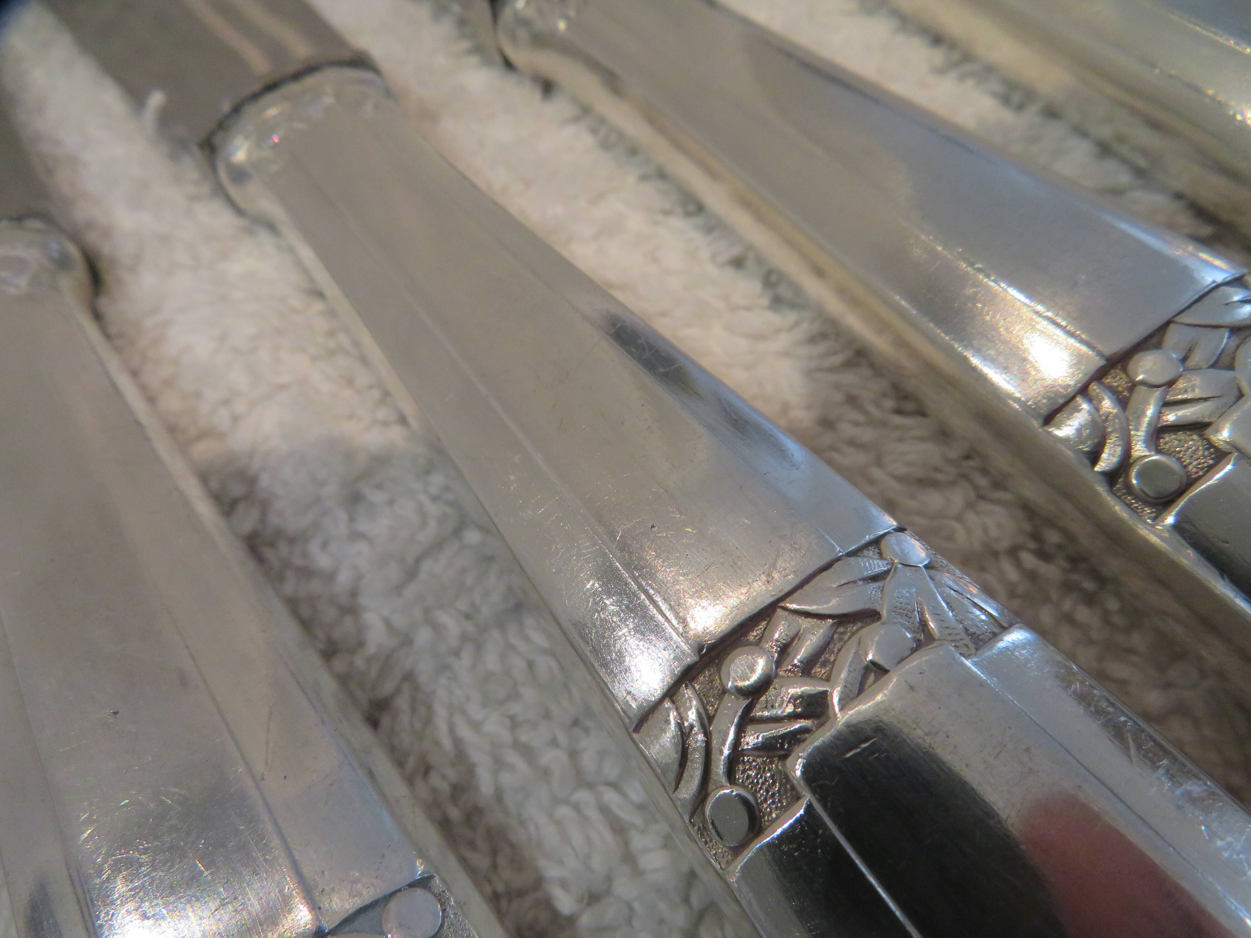 12 silver plated table knives by Argit goldsmith? Art Deco floral bands