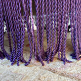 Large armchair, pouffe, purple in velvet.