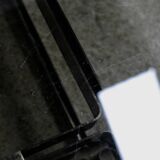 Coffee table with steel base and smoked glass slab. Circa 197