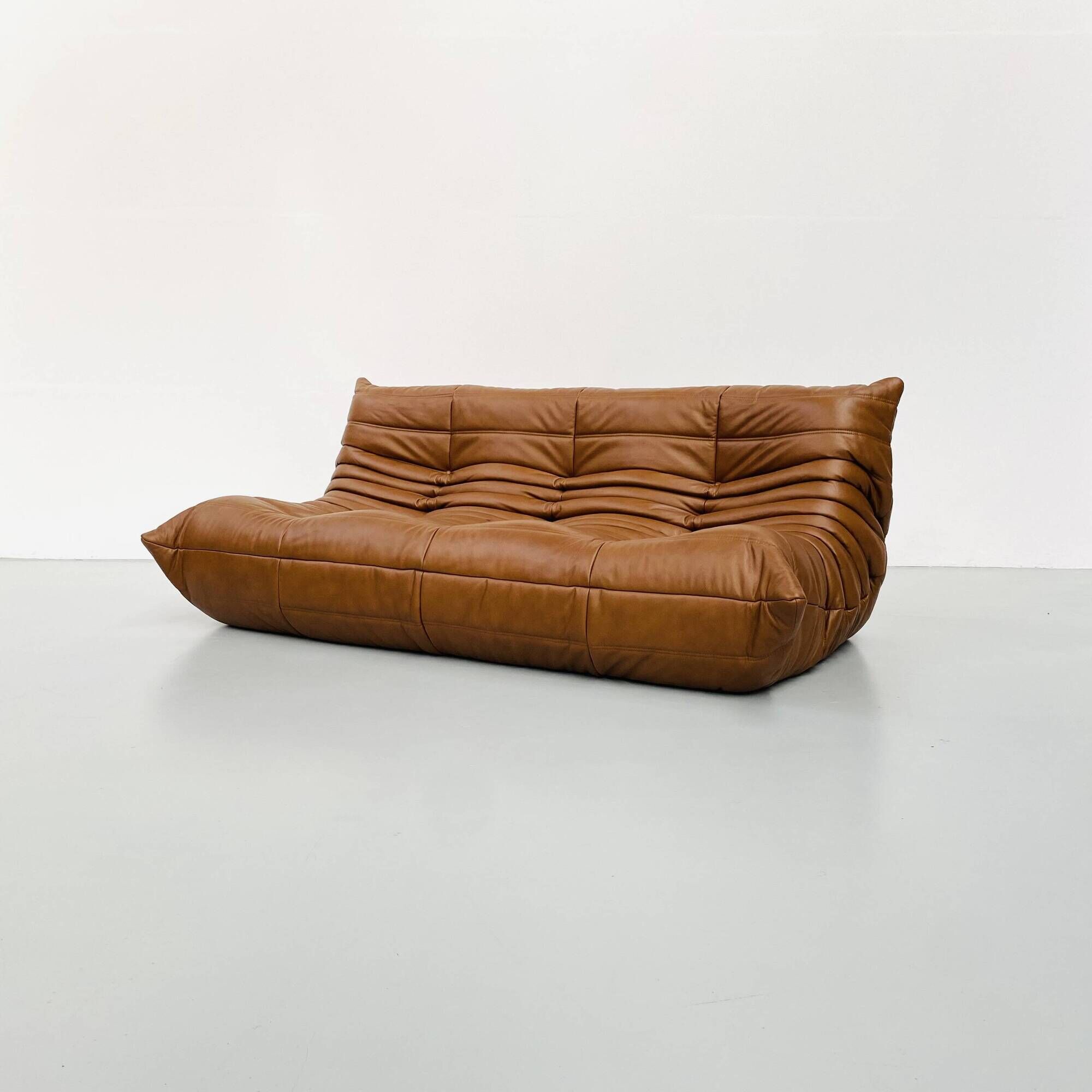 Togo 3-seater in Cognac leather designed by Michel Ducaroy for Ligne Roset.
