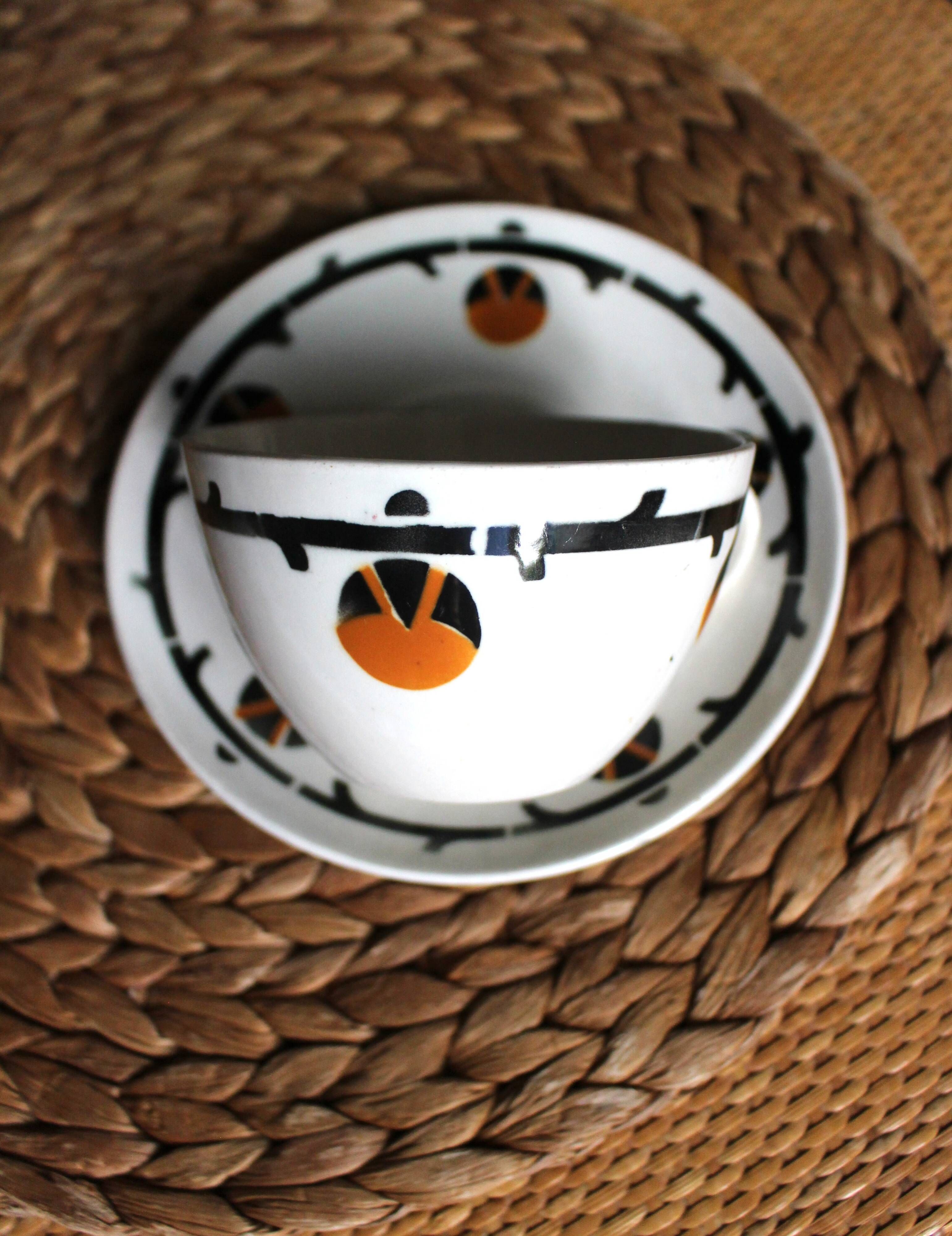 A large cup of chocolate tea, saucer Badonviller Barcarolle orange black.
