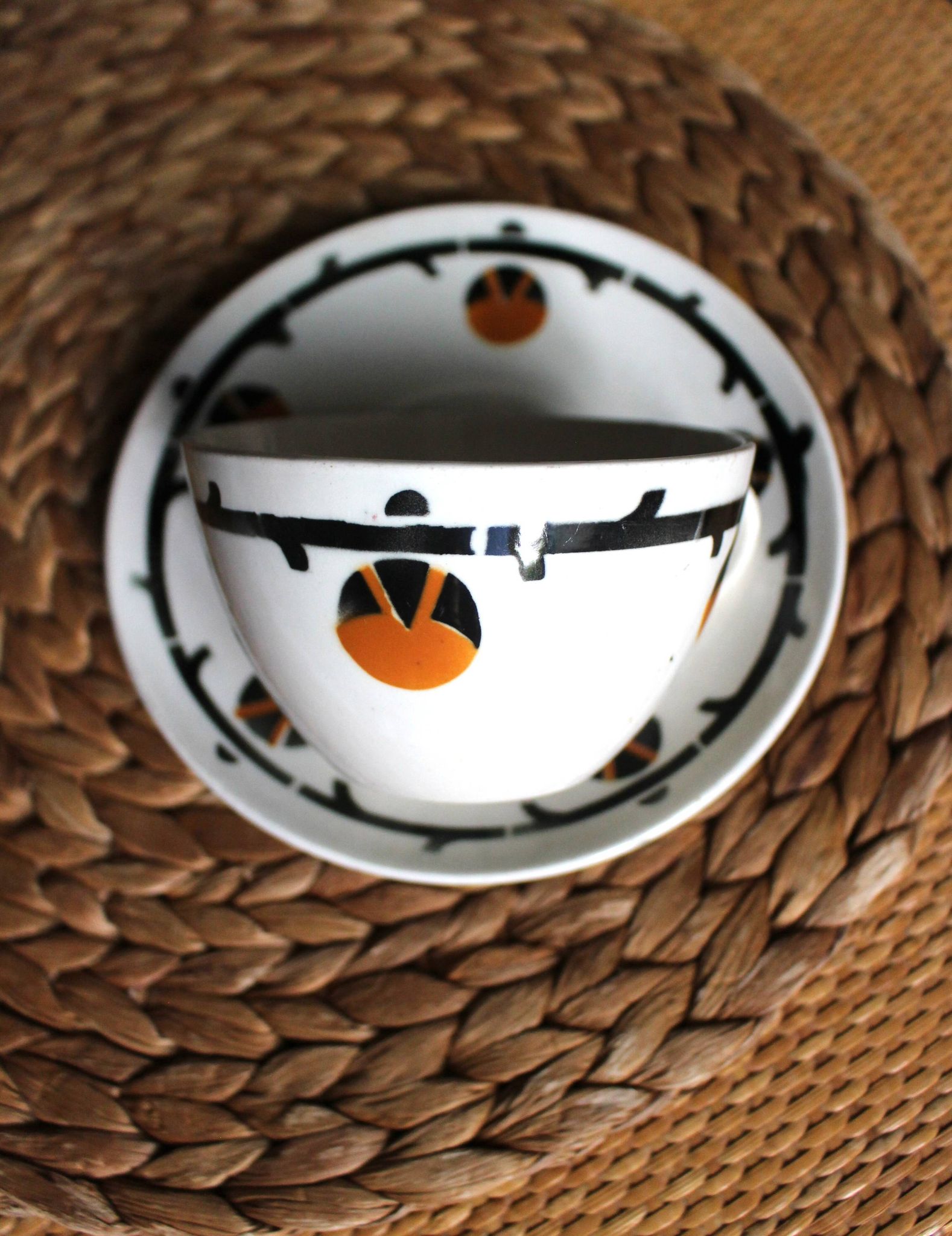 A large cup of chocolate tea, saucer Badonviller Barcarolle orange black.
