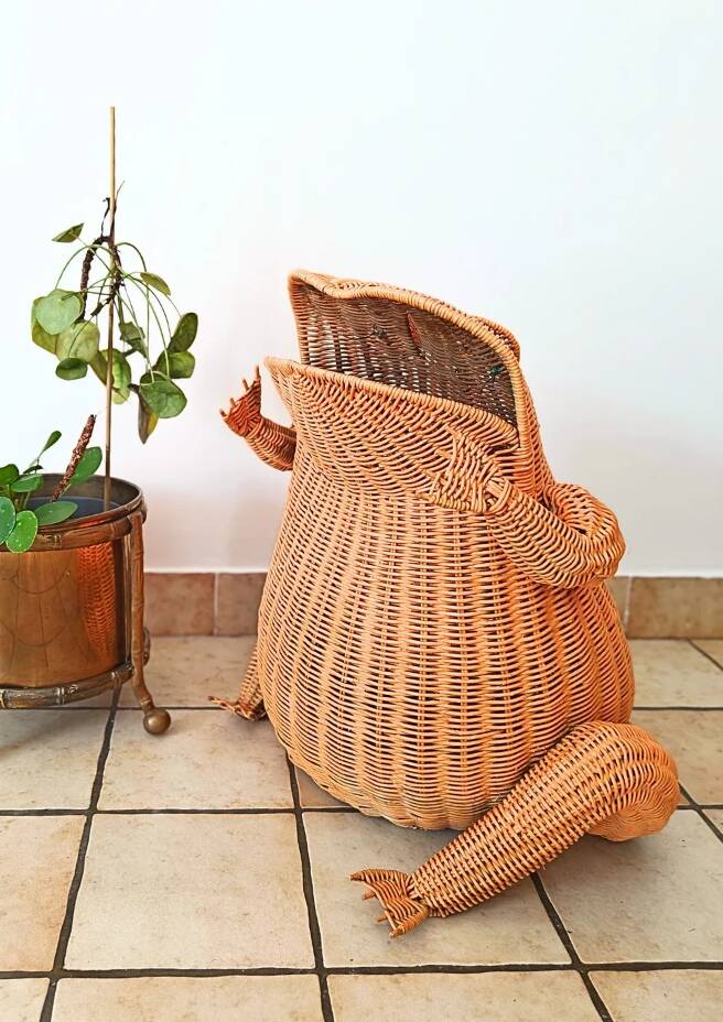 Vintage frog magazine rack in woven wicker design by Olivier Cajan
