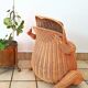 Vintage frog magazine rack in woven wicker design by Olivier Cajan