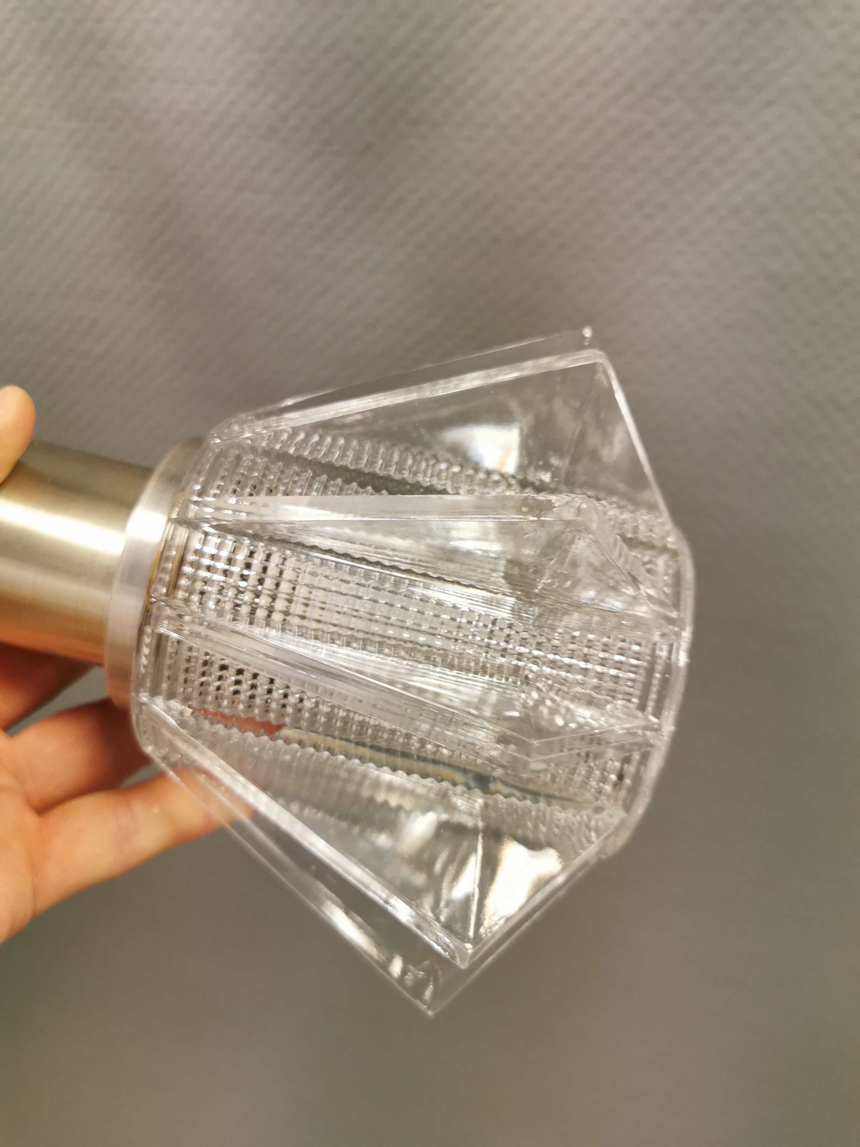 A set of smaller hanging lamps, in hard pressed glass, with metal top