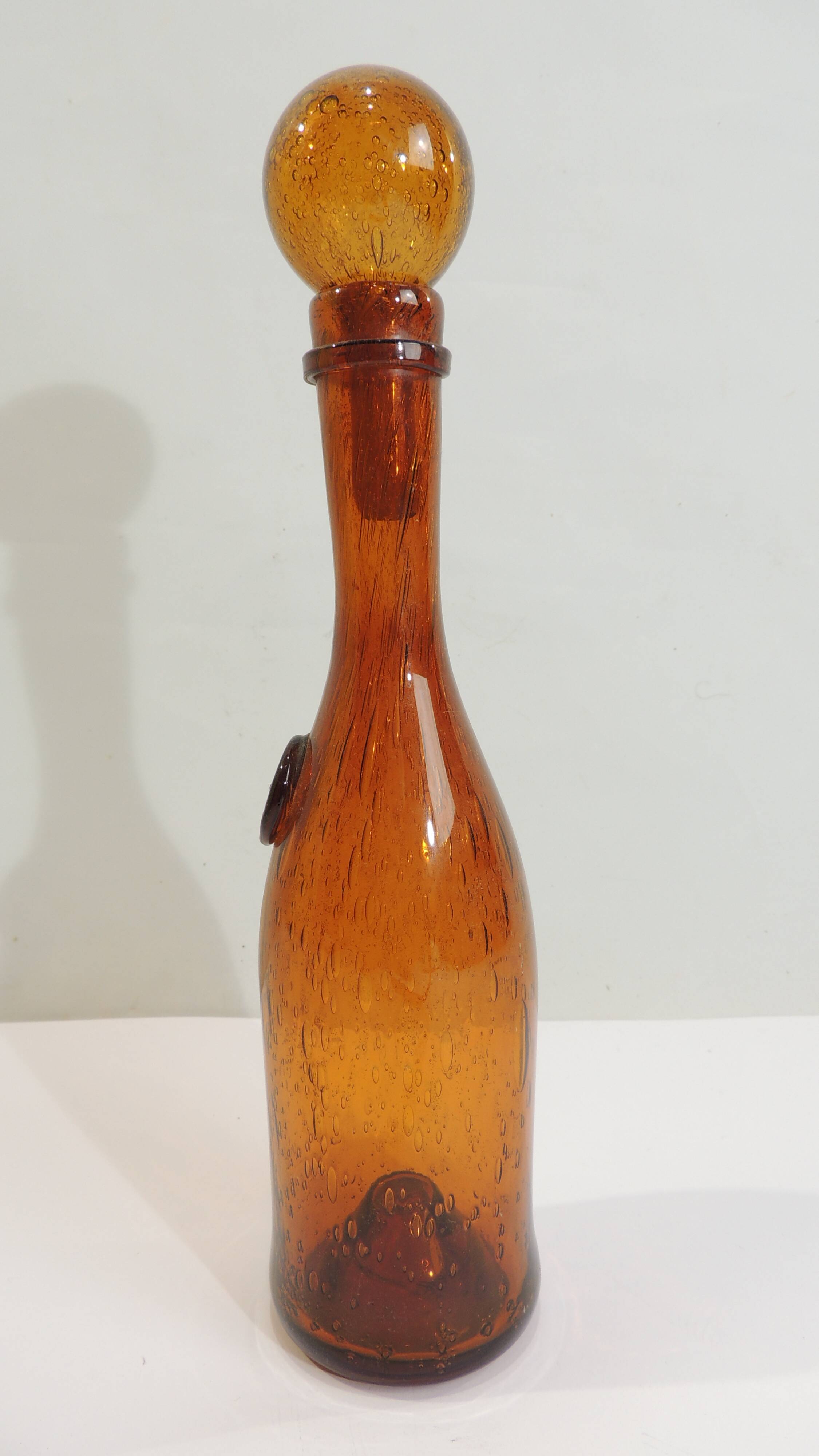 Amber bottle in bubbled blown glass, signed Biot – France, vintage 1970s