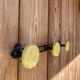 Vintage yellow metal wall coat rack
