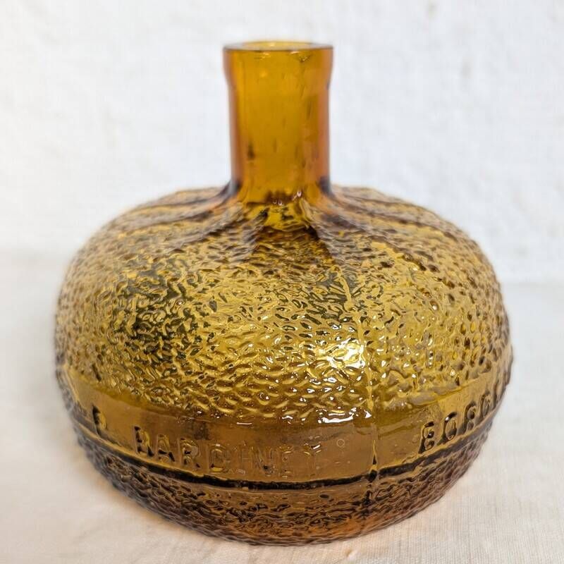 Bouteille en verre ambré texturé forme orange