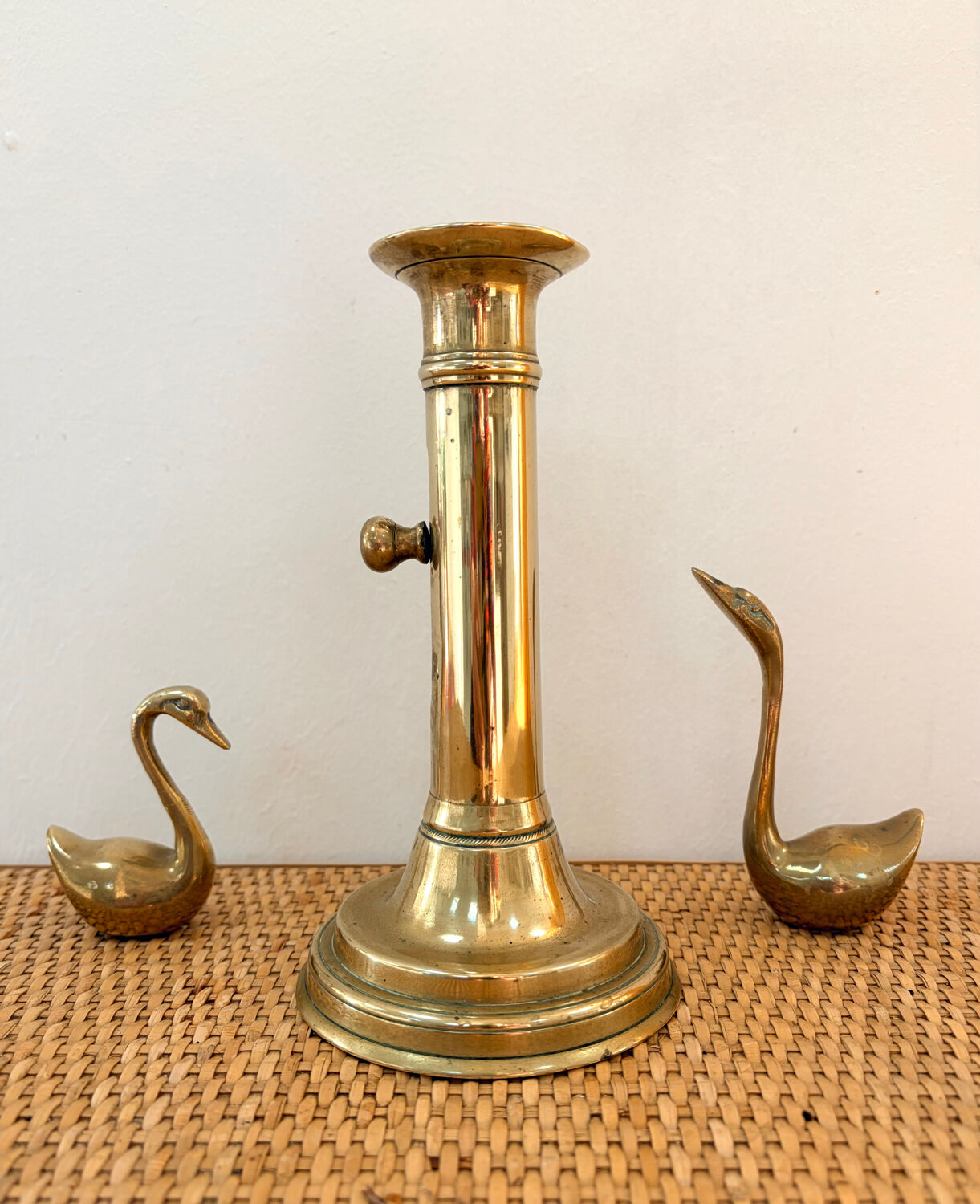 Old brass candlestick with push button.