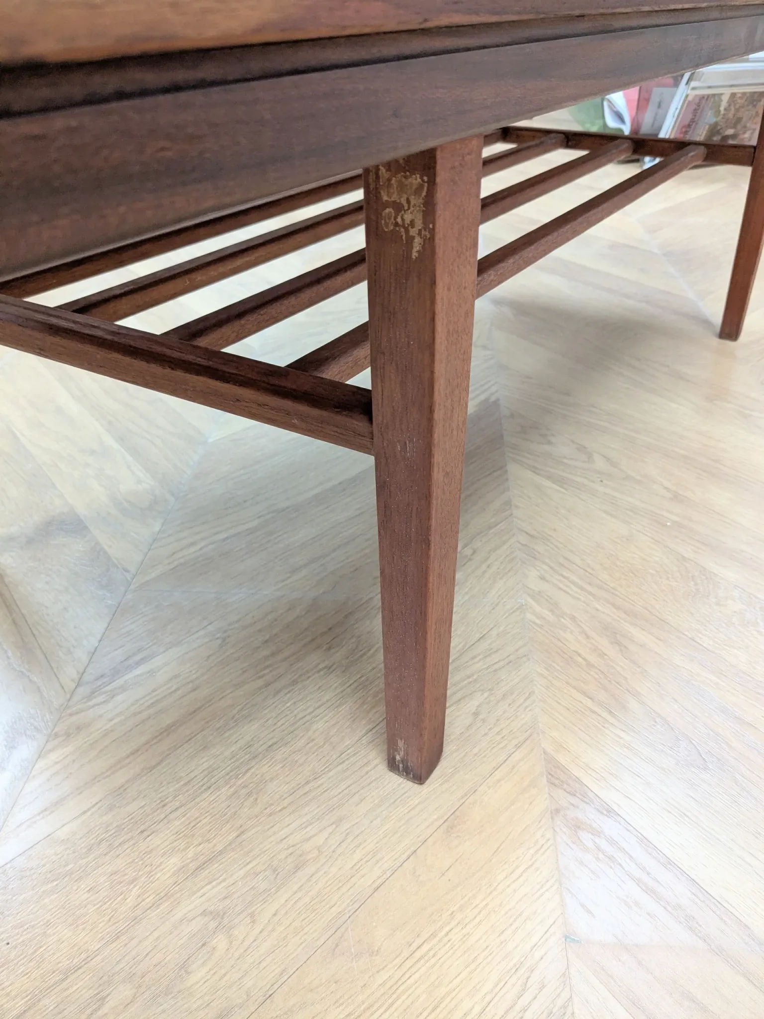 Vintage Danish coffee table in teak with a black top from the 1960s.