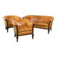 Unique old set of 2 club armchairs and a couch in cognac-colored leather with wheels