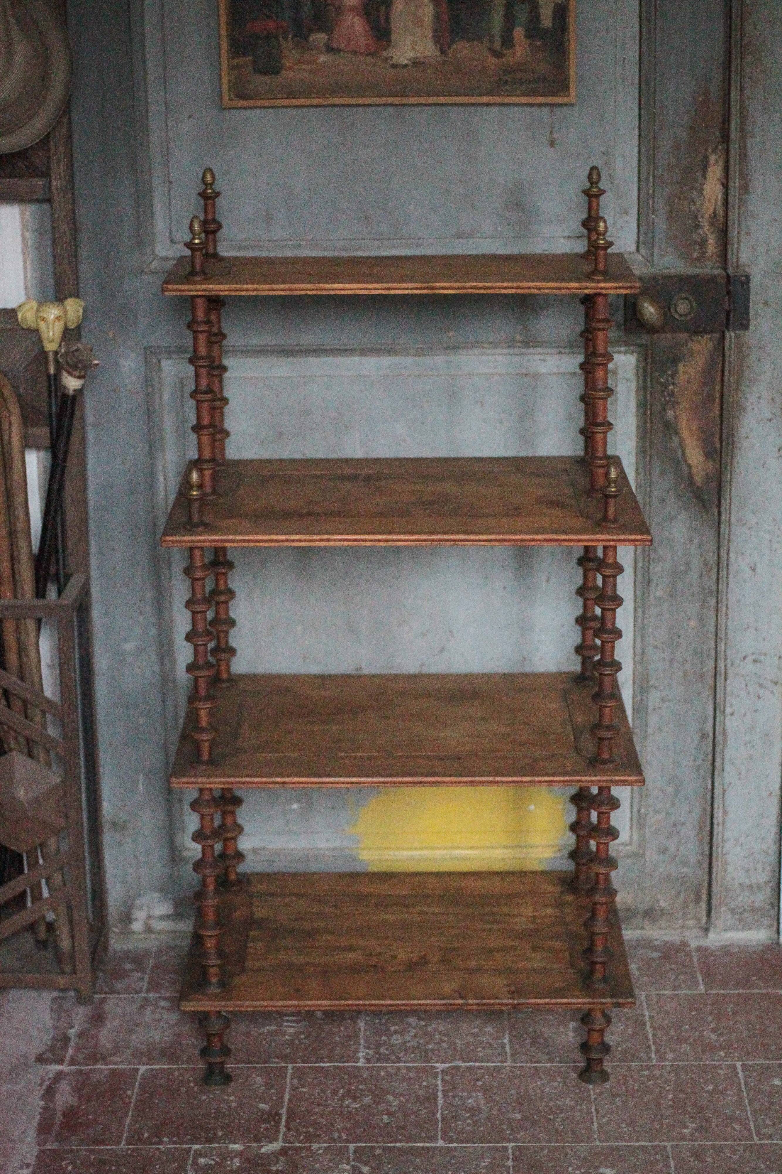 Napoleon III spool shelf, floor-standing shelf with brass tips.