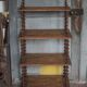 Napoleon III spool shelf, floor-standing shelf with brass tips.