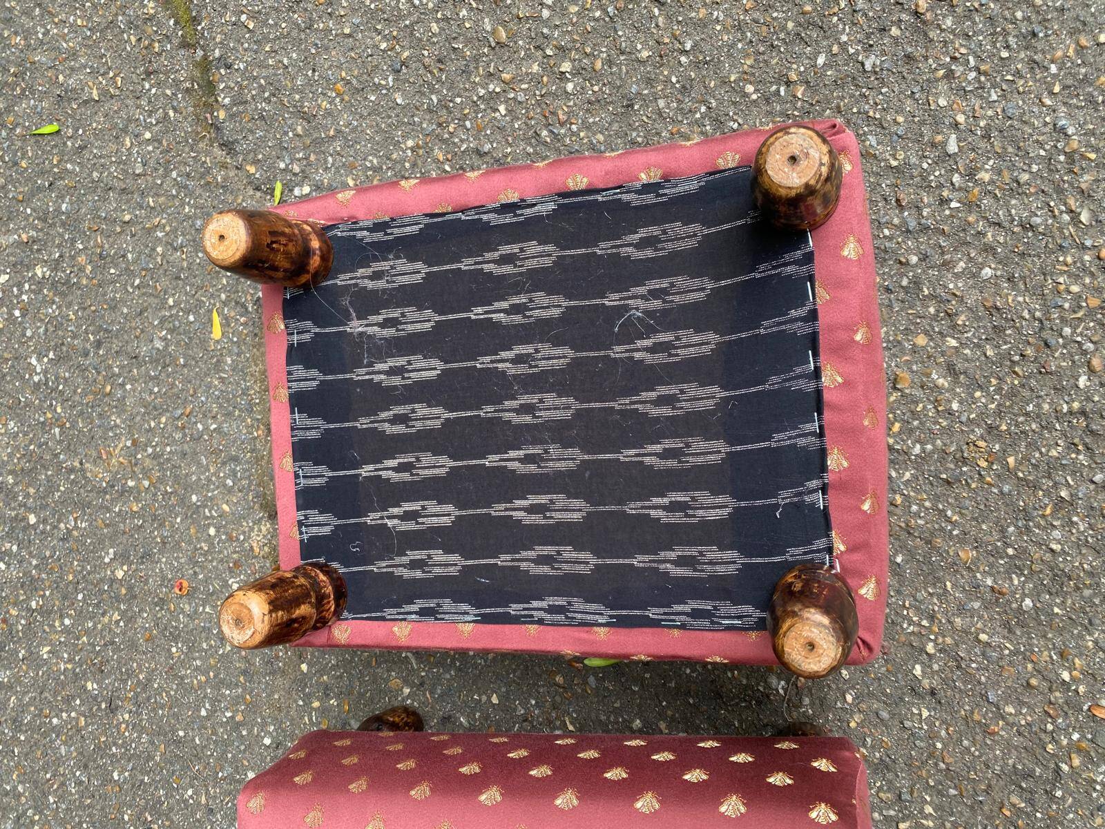 2 low footstools in burgundy fabric and solid wood