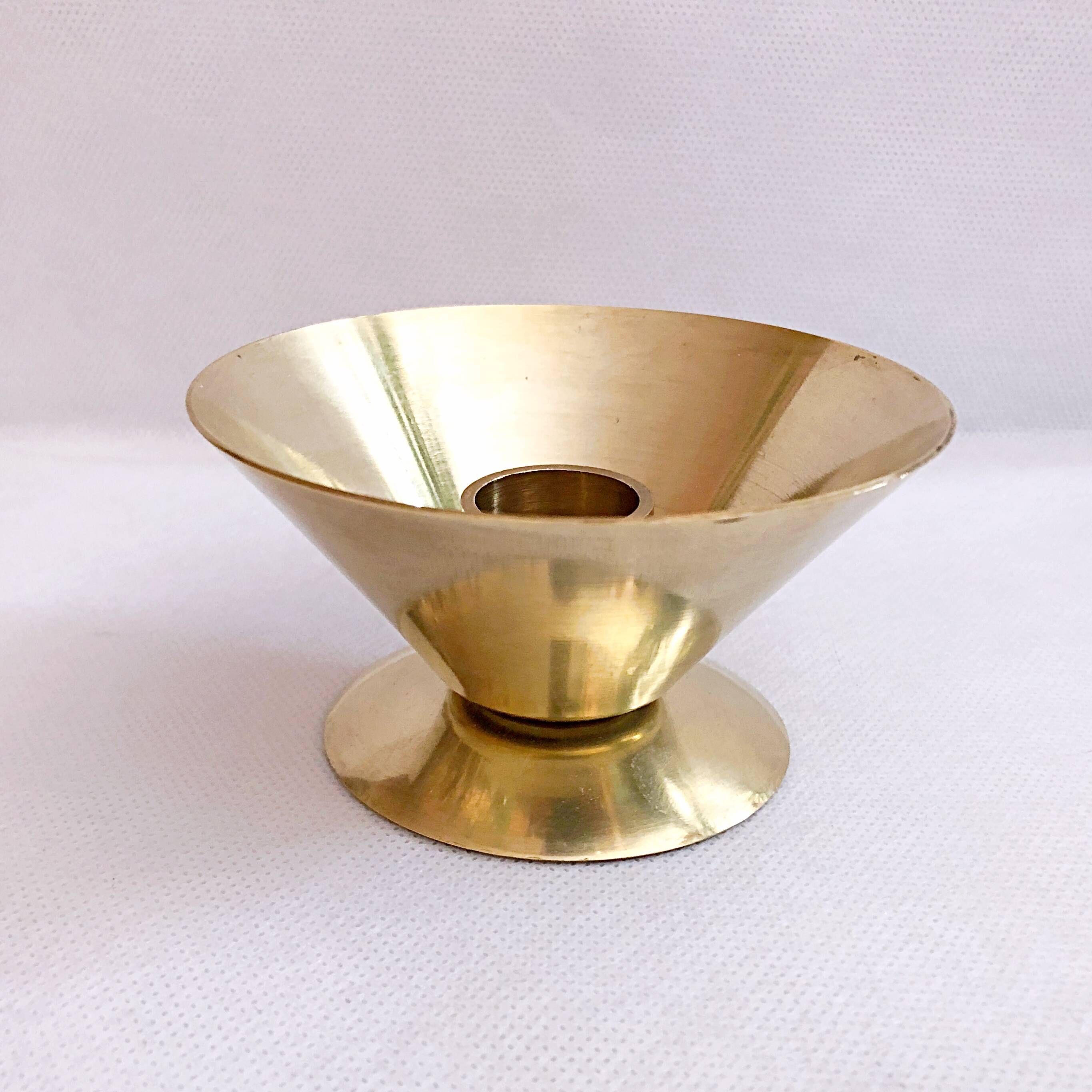 Table candle holder in golden brass