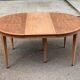 Renovated round extendable dining table made of solid mahogany from the 19th century.