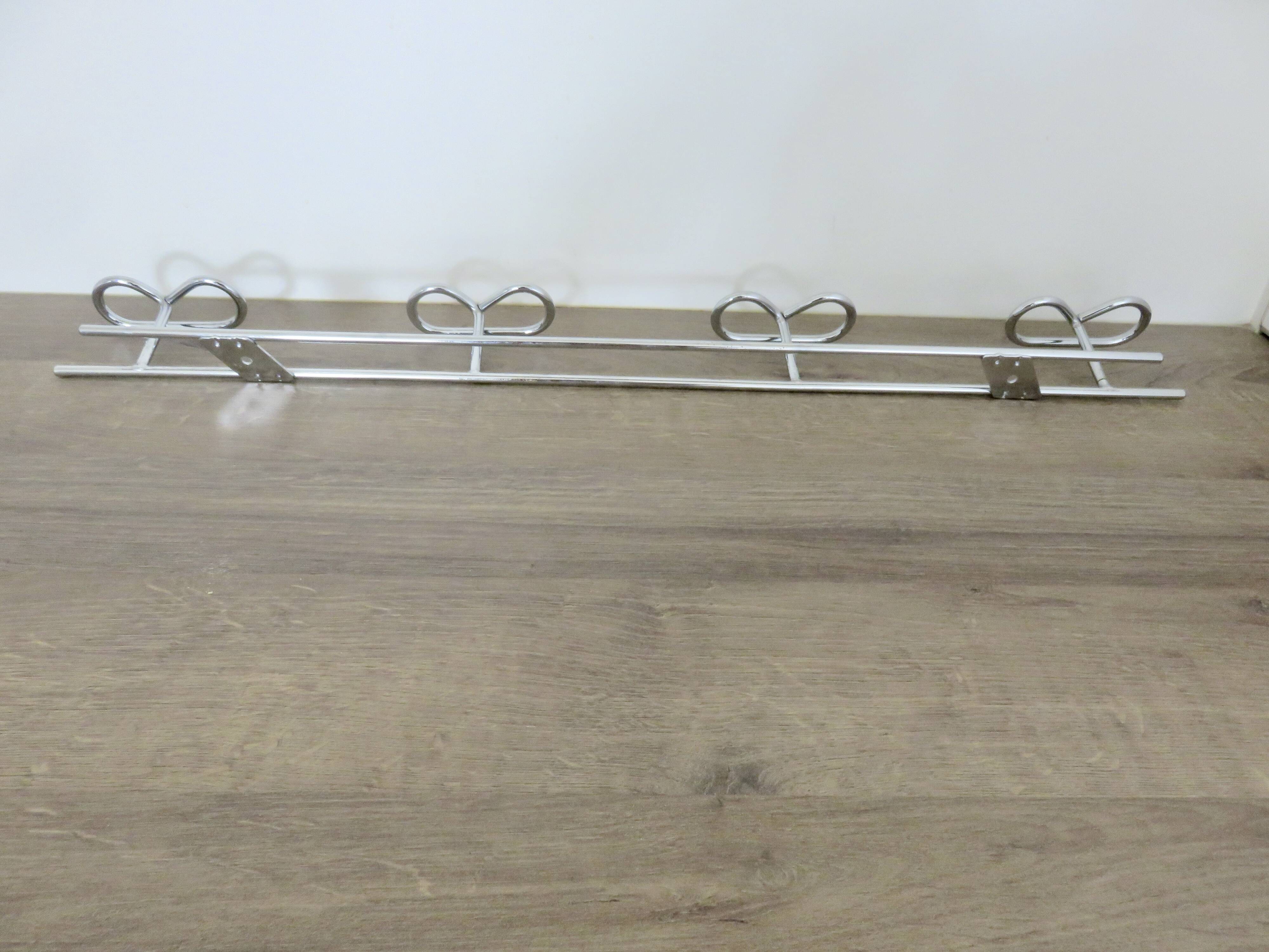 Large vintage wall-mounted coat rack in chrome metal