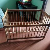 Wooden children's bed with sliding partition.
