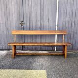 Brutalist bench with dark wood backrest