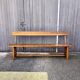 Brutalist bench with dark wood back