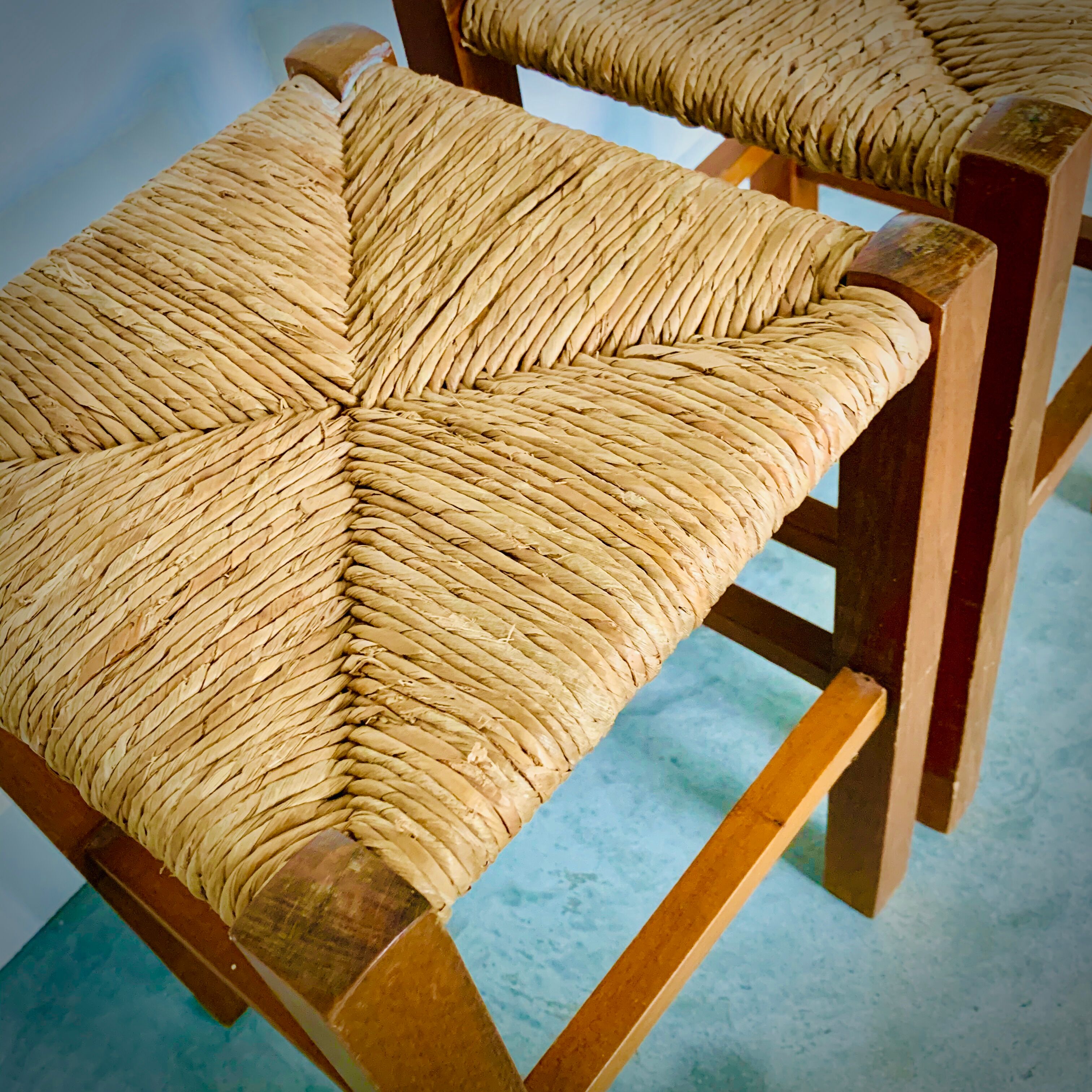 Two light wooden stools varnished and mulched seat