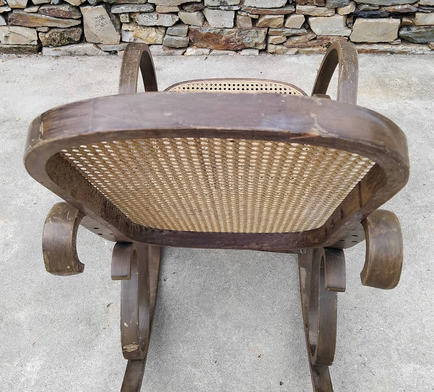 Vintage wooden and cane rocking chair
