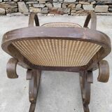 Vintage wooden and cane rocking chair