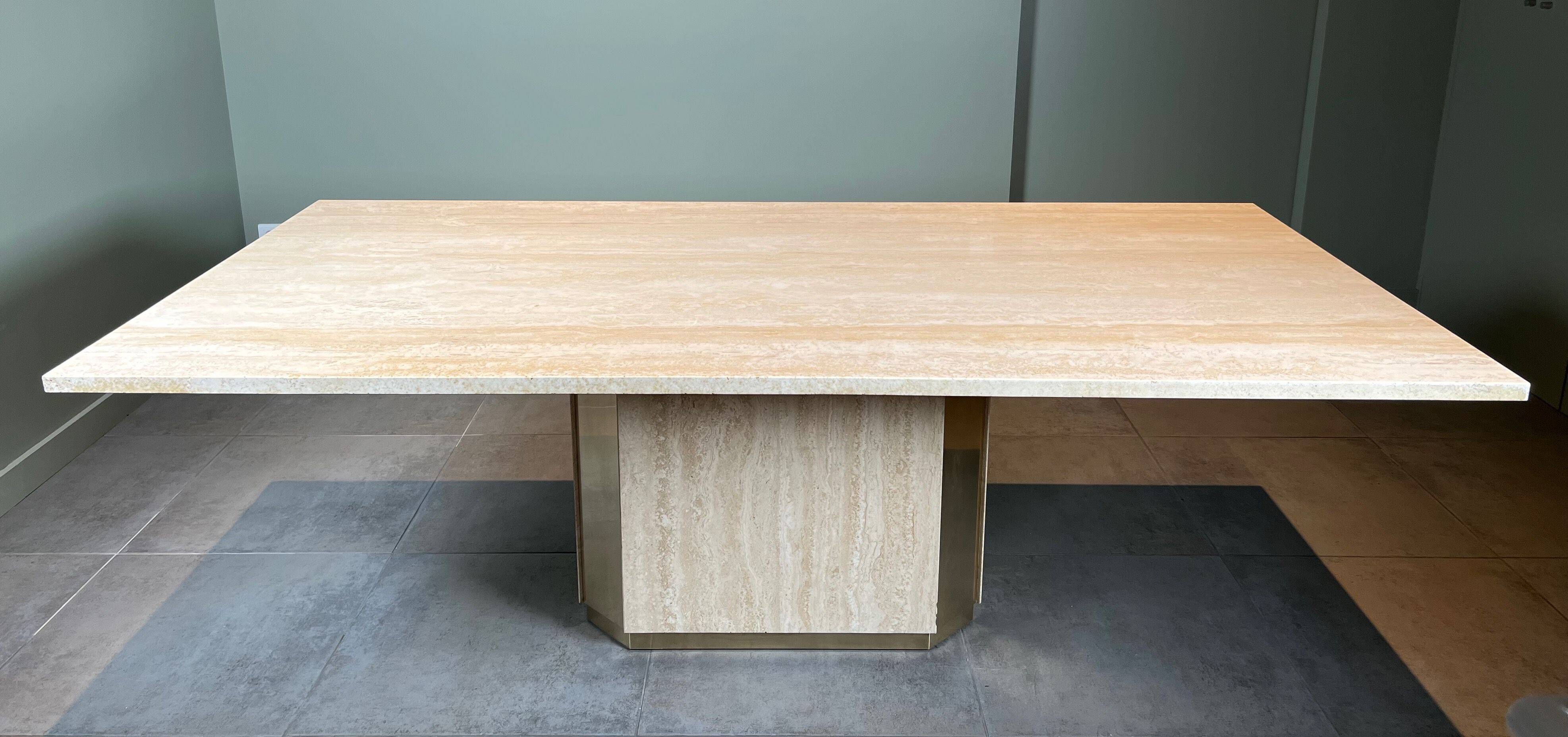 Dining table in travertine and brass. French work. Around 1970.